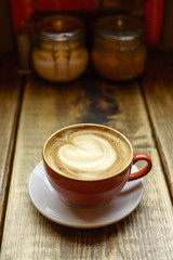 Caffe Latte with wooden background