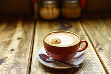 Caffe Latte with wooden background