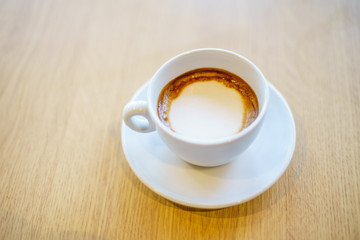Americano Caffe with wooden background