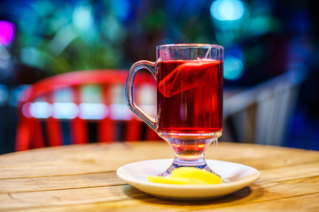 Red Fruit Tea with wooden background