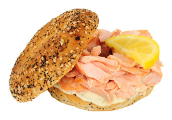 Salmon fish and cream cheese filled bagel sandwich isolated on a white background