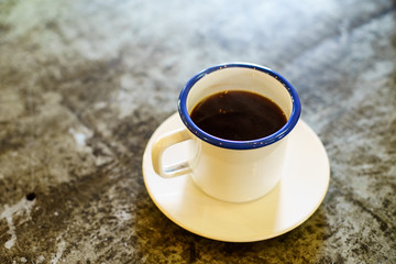 Americano Caffe with wooden background