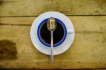 Americano Caffe with wooden background