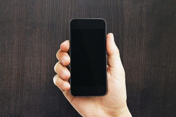 Male hand holding empty phone
