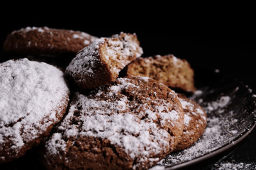 oatmeal cookies on a black table in castor sugar
