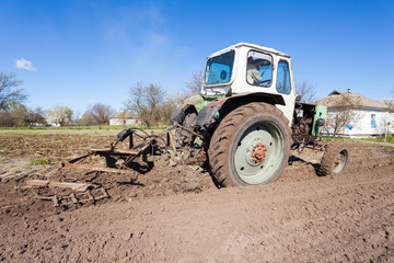Tractor plows a plot of land