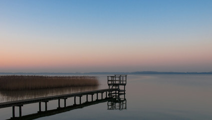 Fototapeta na wymiar Panorama, footbridge, and quiet scene on the lake in the north, Germany