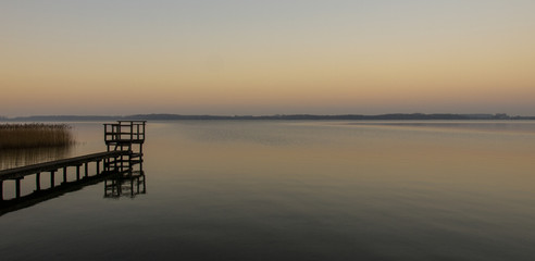 Obraz premium Panorama, footbridge, and quiet scene on the lake in the north, Germany