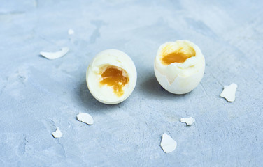 tasty boiled eggs over rustic background