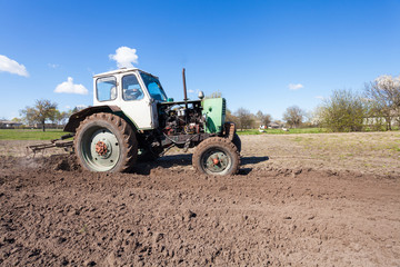 Tractor plows a plot of land