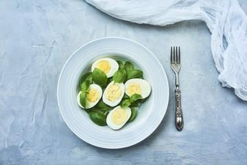 tasty boiled eggs over rustic background