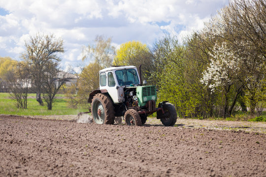 Tractor plows a plot of land