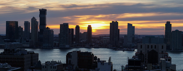 Skyline view of Manhattan & Jersey City at night in New York City.