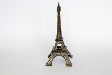 figurine of the eiffel tower on a white background