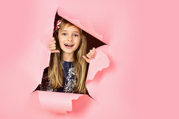 Hairdresser and casual style or denim. Little girl with long hair. Beauty, kid fashion, cosmetics, healthy hair. Stylish girl with pretty face on grey background. Fashion model and beauty look.