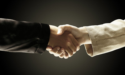 closeup.reliable handshake business partners.the concept of coo