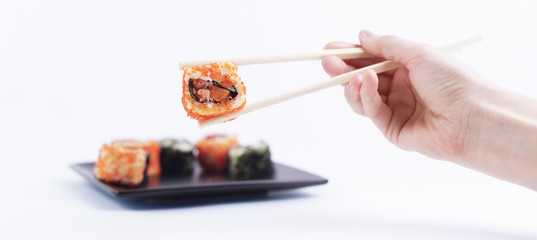 Sushi rolls with white sticks. Japanese cuisine.