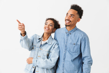 Happy african couple posing together and looking away