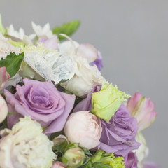 The delicate rustic floral bouquet of rose lilac peony on grey background