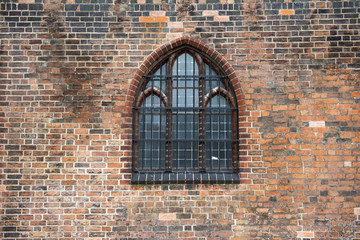 Old brick wall background with window.