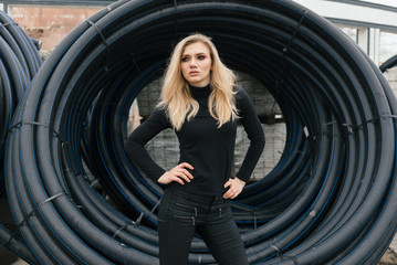 a slender girl looks and stands in the distance