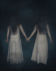 Two terrible ghost with horns on dark. Back pose