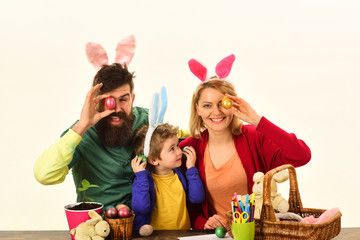 Easter eggs family bunny with funny bunny ears. Easter egg decorating happy family.
