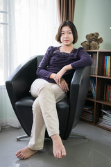 Young asian woman short hair relaxation in living room