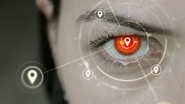 Young cyborg female blinks then location pin symbols appears.