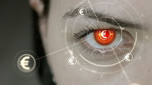 Young cyborg female blinks then Euro currency symbols appears.