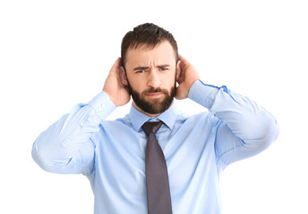 Young man with hearing problem on white background
