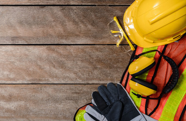 Standard construction safety equipment on wooden table. top view