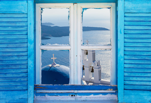 Beautiful vintage Greek window with blue shutters. Typical Greek picture.