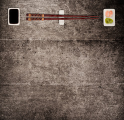 Traditional japanese sushi sticks on rustic concrete background.