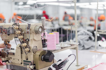 sewing machine on blurred background. textile workshop. closeup