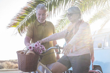 happy senior couple outdoor in bicycle activities