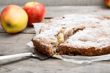 apple pie with whole-grain flour on a wooden background. concept of healthy eating