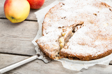 apple pie with whole-grain flour on a wooden background. concept of healthy eating