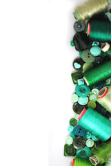 Multicolored accessories for sewing, bright threads, buttons and cloth