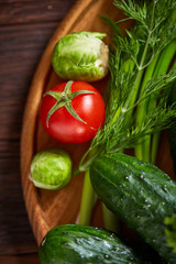 Fresh vegetables composition over wooden background, close-up, flat lay.