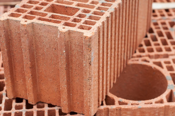 Obraz na płótnie Canvas closeup of terra cotta bricks pile in construction site