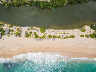 View of the ocean coast and palm groves. beautiful tropical beach shot by drone. Aerial View