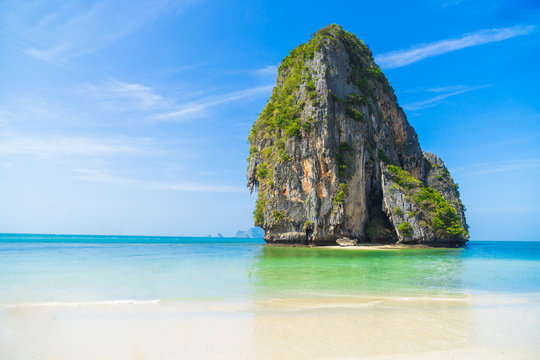 White sand, blue water beach with mountain at Phra Nang Cave beach in Krabi, Thailand