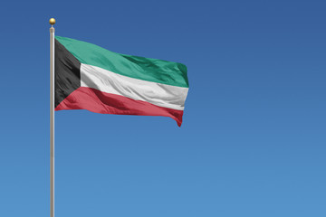 Kuwait Flag in front of a clear blue sky