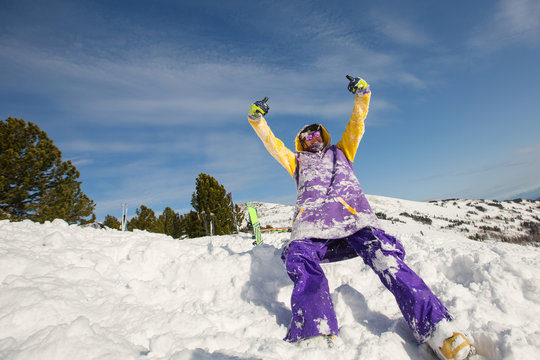Guy have fun and playing on snow mountain top. Snowboard, freeride and winter holiday