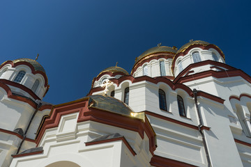 The building of the new Athos monastery with glittering domes .