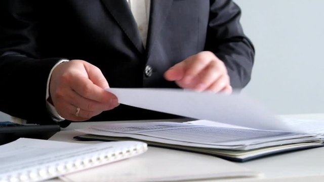 Businessman Working with Papers Close Up