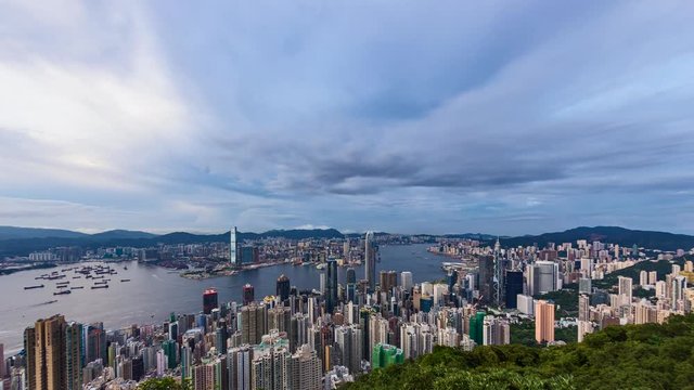 Hong Kong. 4K City Timelapse. Timelapse video of Hong Kong from day to night. Wide and high angle view from the Peak of Hong Kong. Office buildings and busy traffic under clear night sky.