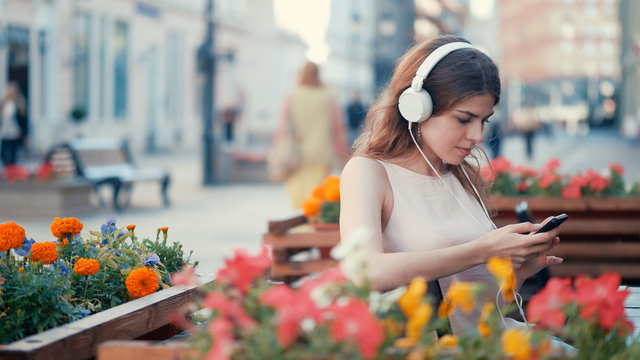 Young attractive girl listen to music