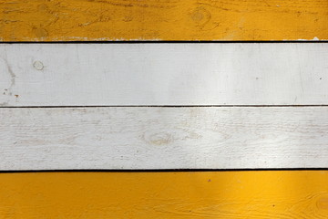 Background of wooden boards, white and yellow painted boards, wooden texture of different colors, minimalism, smooth lines, blank for the designer